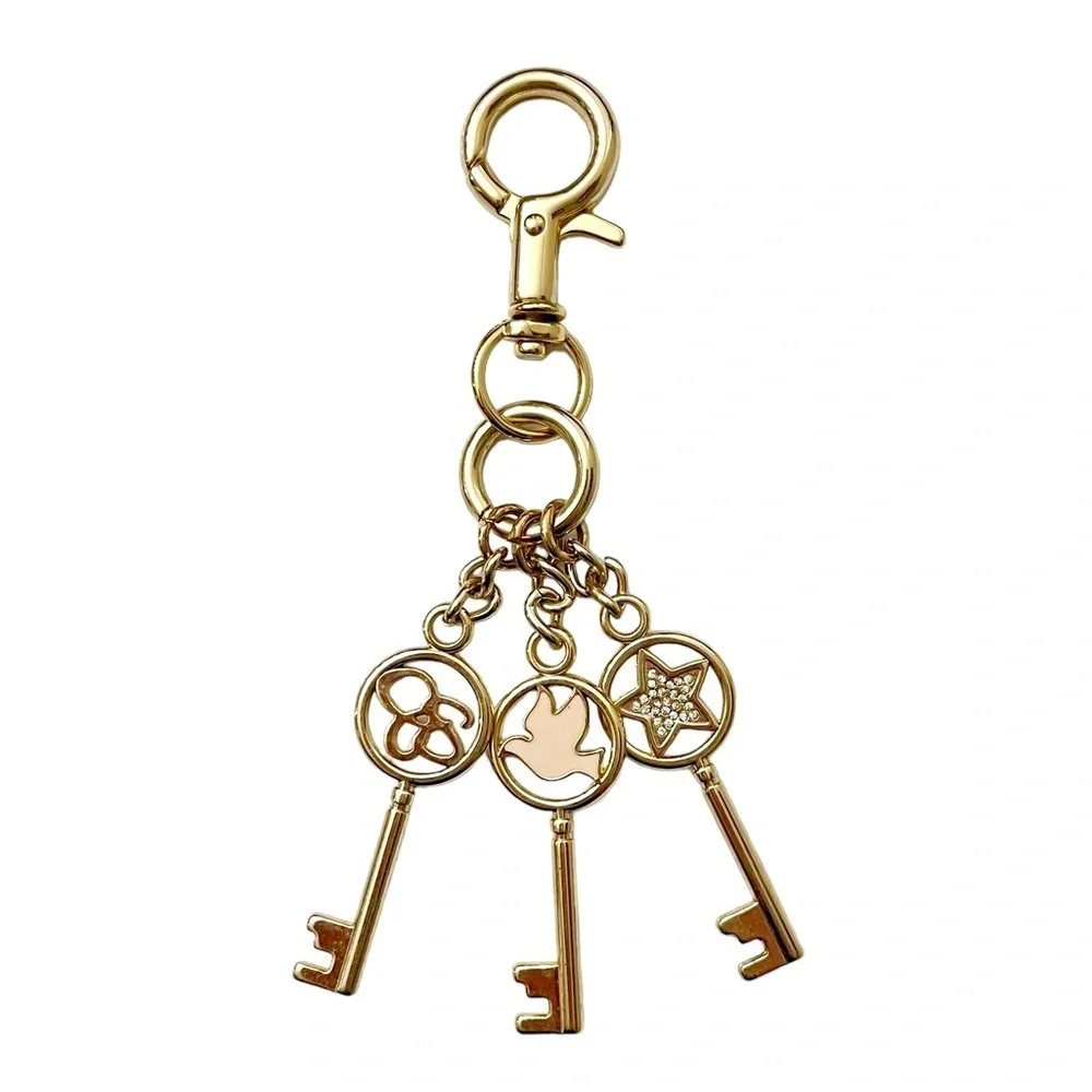 Bag Charm Key Chain Gold Tone‎ Jessica Simpson Logo Dove Star 3 Key Bag Clip